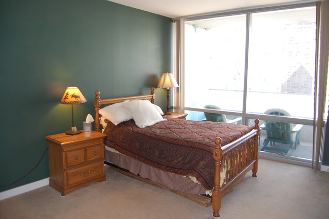 8 East Randolph Street, Unit 1803 Chicago, IL 60601 - Photo 15 of 16 a bedroom with a bed and a window