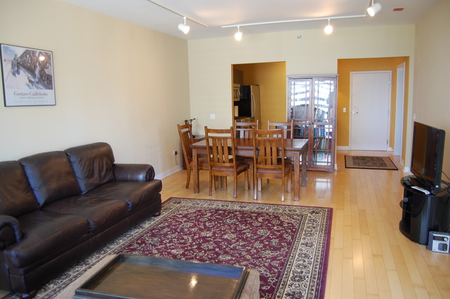 8 East Randolph Street, Unit 1803 Chicago, IL 60601 - Photo 6 of 16 a living room with furniture a dining table and a flat screen tv