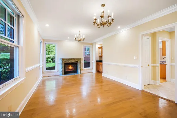 a large kitchen with stainless steel appliances granite countertop a stove a sink and a microwave