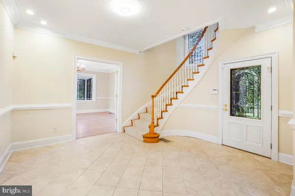 a view of an empty room with a fireplace and a window