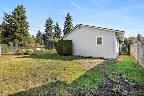 a house view with a backyard space