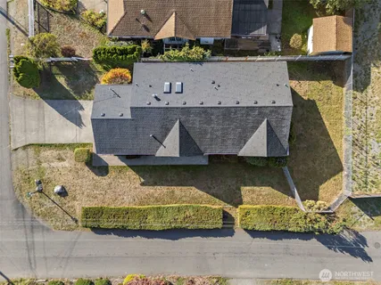 an aerial view of a house with swimming pool