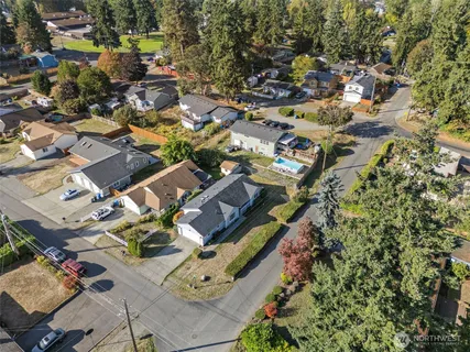 an aerial view of residential houses with outdoor space