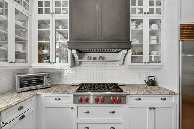 a bedroom with a bed furniture and a large window