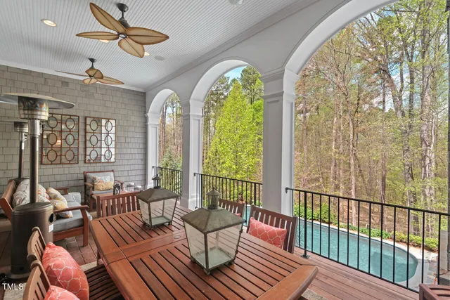 a bedroom with a bed couch and a large window