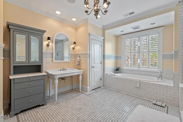 a kitchen with stainless steel appliances granite countertop a stove a refrigerator a sink dishwasher and a dining table with wooden floor