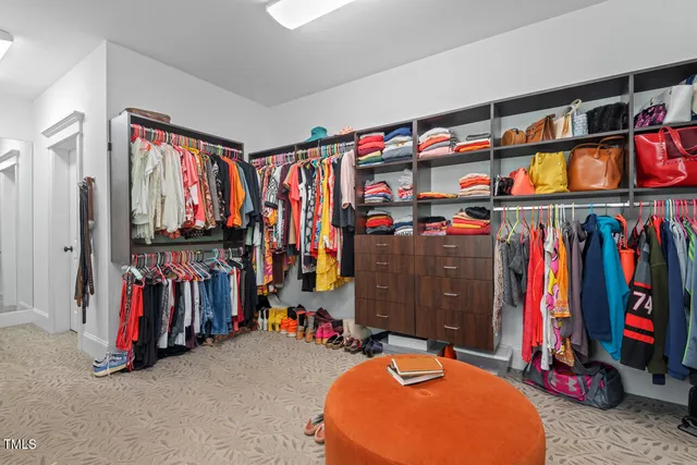 a store room with lots of different colored cloths