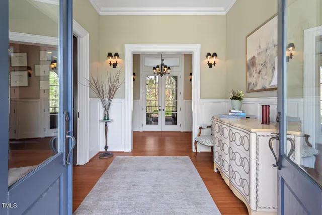 a kitchen with granite countertop lots of clutter and stainless steel appliances