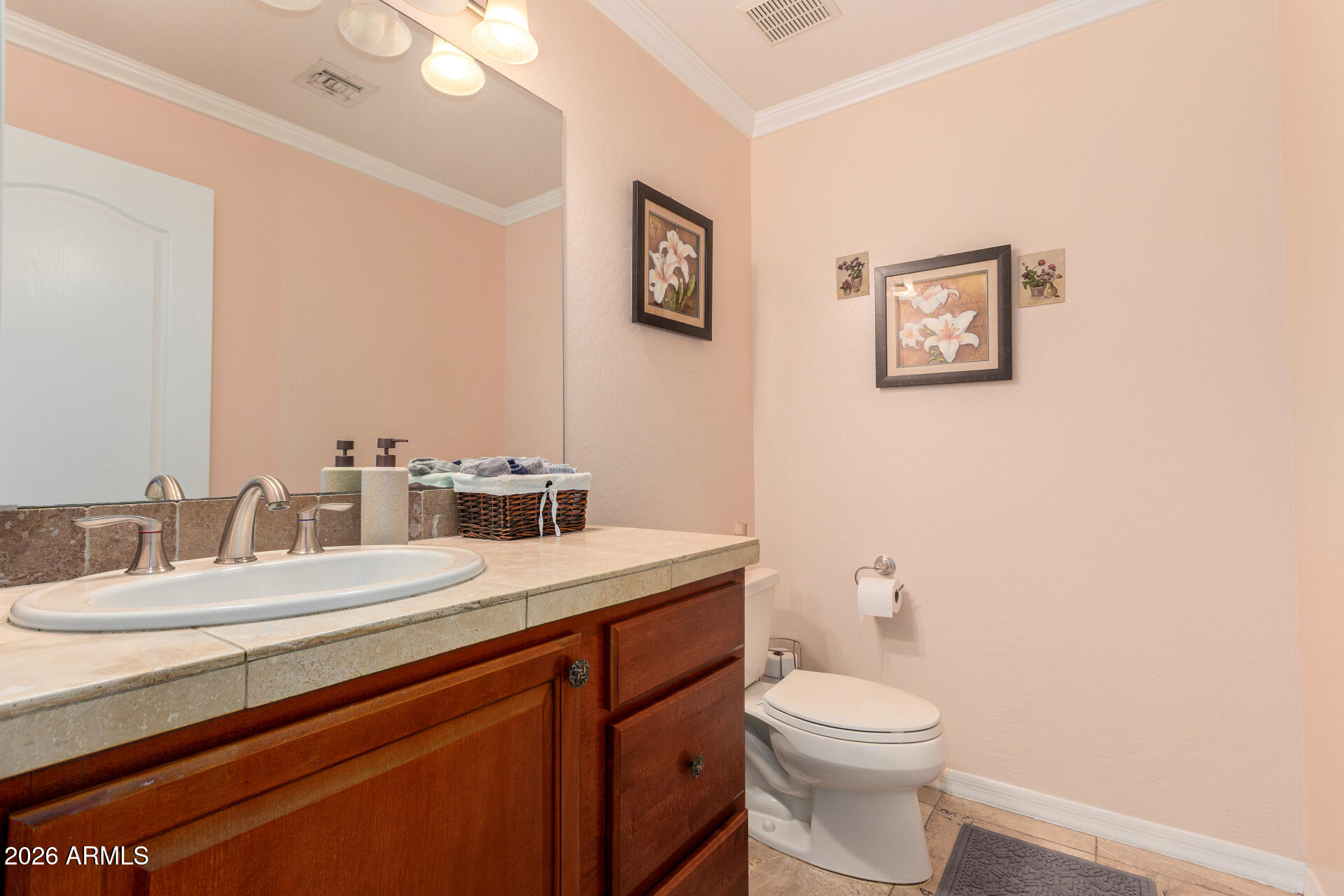 8912 North 15th Lane Phoenix, AZ 85021 - Photo 20 of 36 a bathroom with a toilet sink and mirror