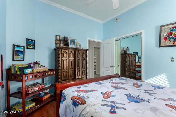 a bedroom with a bed and dresser