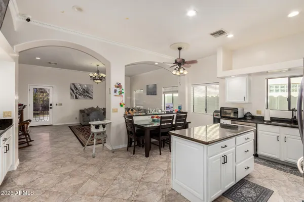 a kitchen with counter top space appliances and cabinets