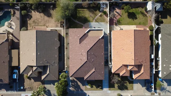 an aerial view of residential houses with outdoor space