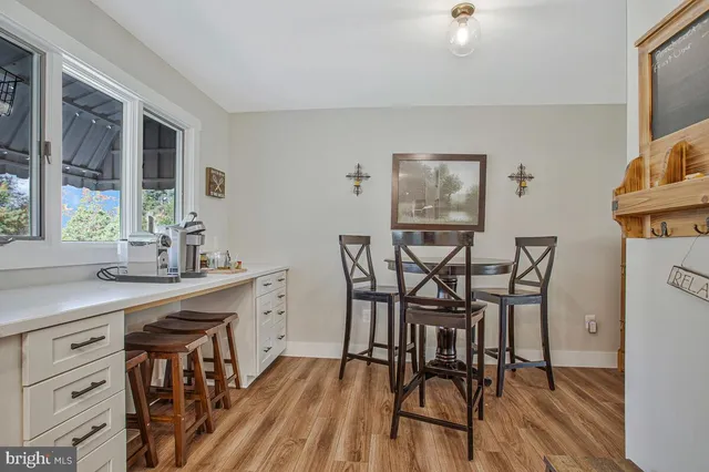 a view of a dining room with furniture and window