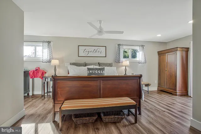 a view of bedroom with furniture and wooden floor