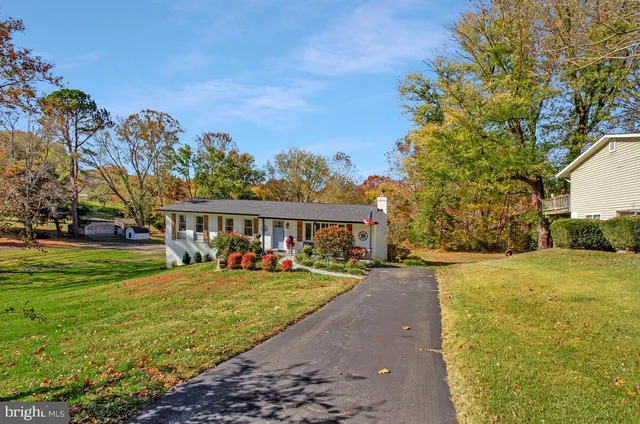 a view of a house with a big yard