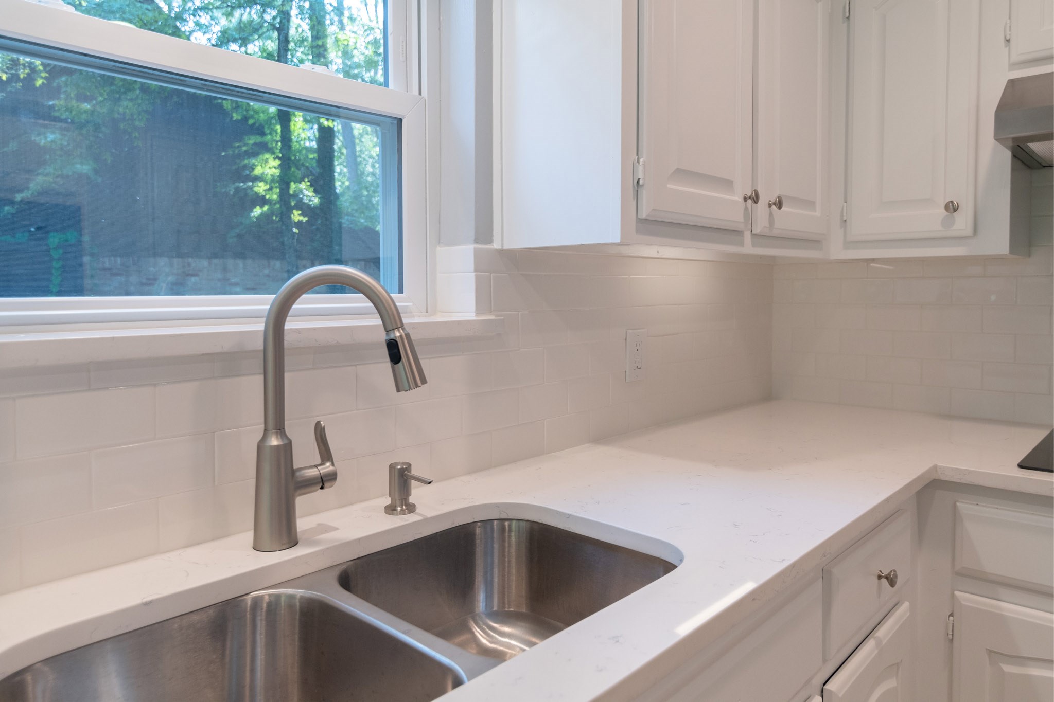 10 Coralvine Court Spring, TX 77380 - Photo 13 of 34 New undermount stainless steel sink looks great with window above for natural light.