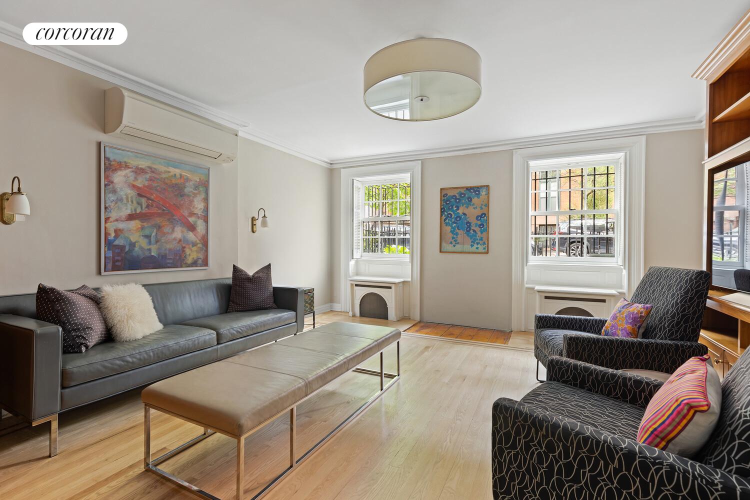 122 State Street Brooklyn, NY 11201 - Photo 12 of 26 a living room with furniture and a large window