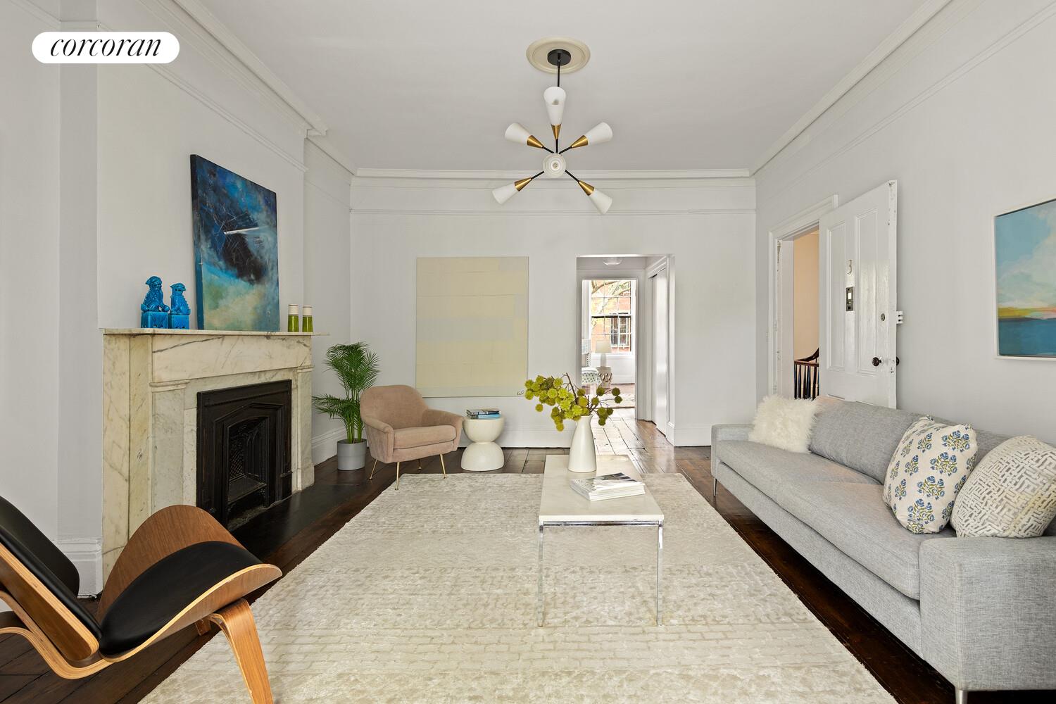 122 State Street Brooklyn, NY 11201 - Photo 15 of 26 a living room with furniture and a fireplace