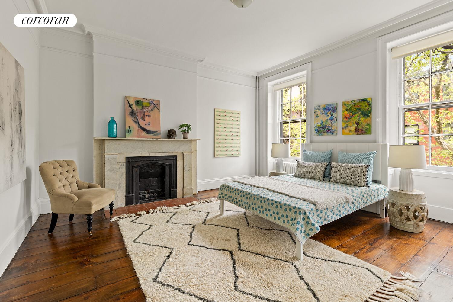 122 State Street Brooklyn, NY 11201 - Photo 17 of 26 a bedroom with a bed and a fireplace