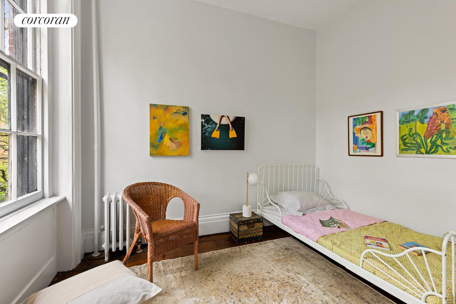 122 State Street Brooklyn, NY 11201 - Photo 18 of 26 a bedroom with a bed and furniture