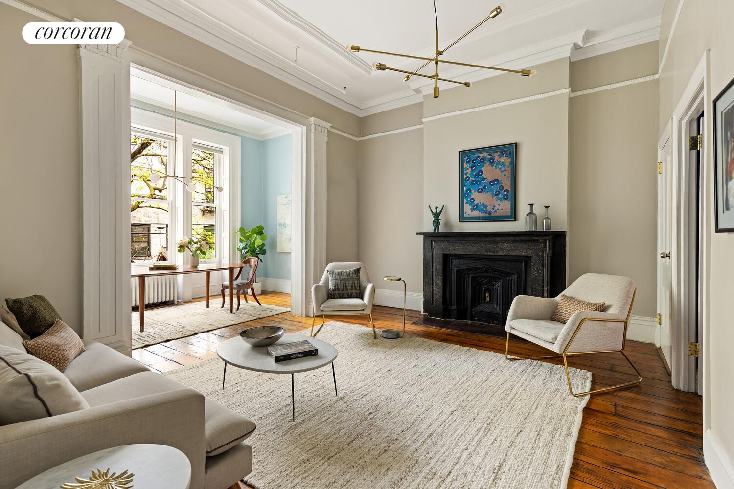 122 State Street Brooklyn, NY 11201 - Photo 1 of 26 a living room with furniture a fireplace and a table