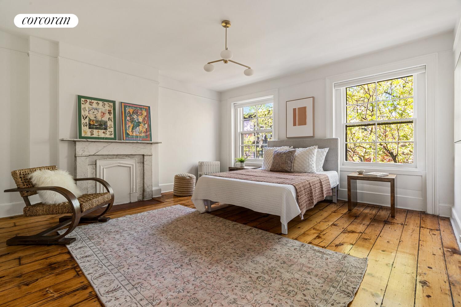 122 State Street Brooklyn, NY 11201 - Photo 22 of 26 a bedroom with a bed and a window