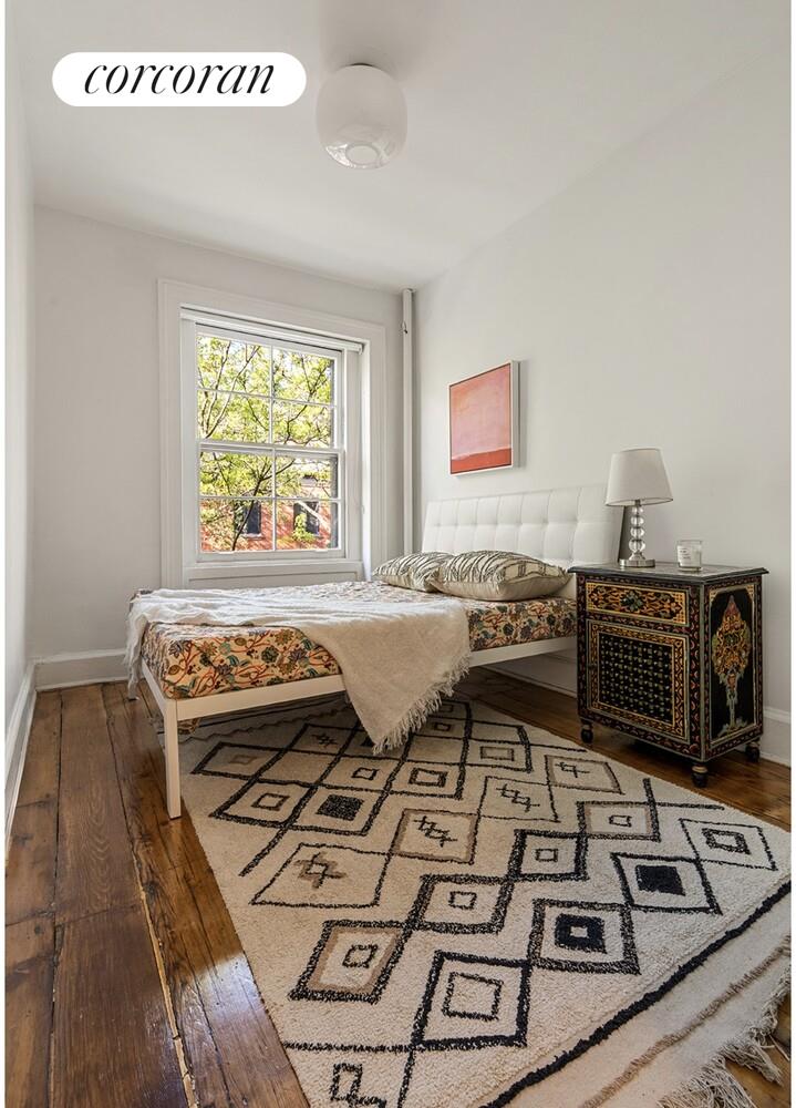 122 State Street Brooklyn, NY 11201 - Photo 23 of 26 a bedroom with a bed and a stove