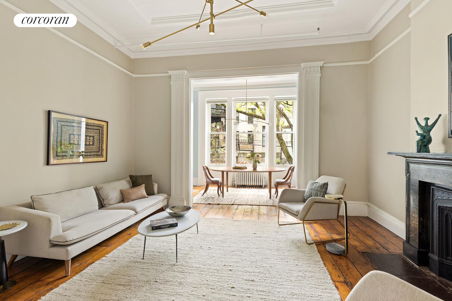 122 State Street Brooklyn, NY 11201 - Photo 2 of 26 a living room with furniture and a fireplace