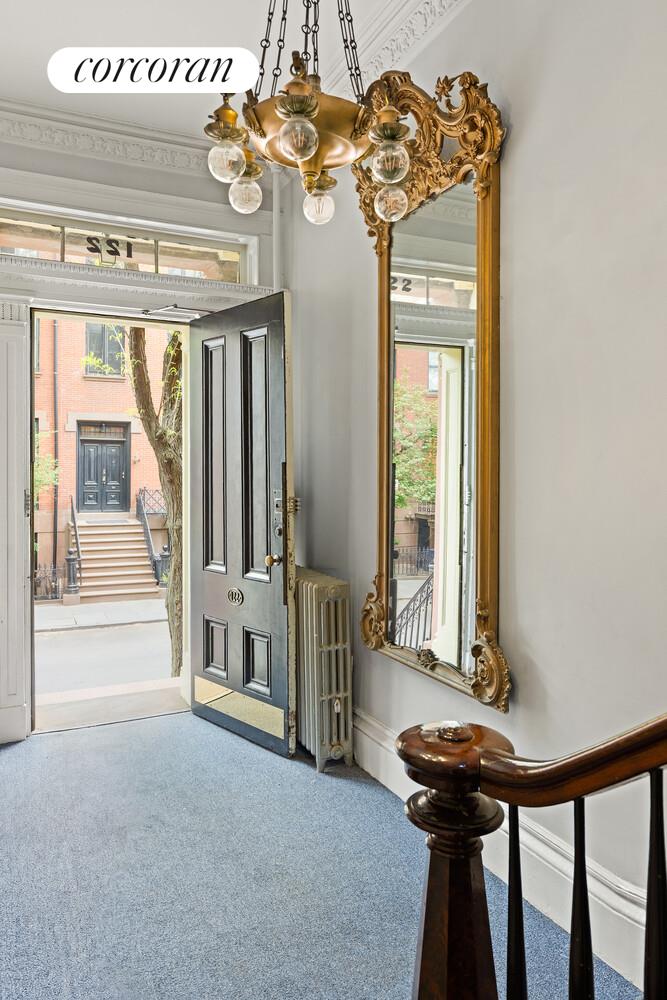 122 State Street Brooklyn, NY 11201 - Photo 6 of 26 a view of an entryway with a chandelier