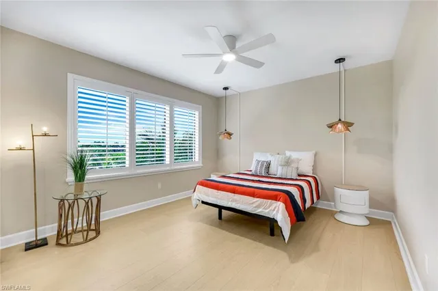 a bed room with a bed and a chandelier