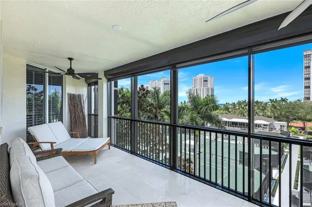a living room with large windows