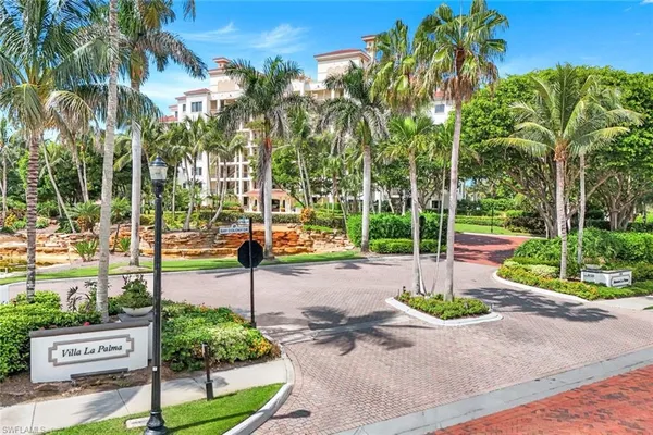 a view of a park with potted plants