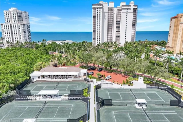 a view of a patio with table and chairs and potted plants