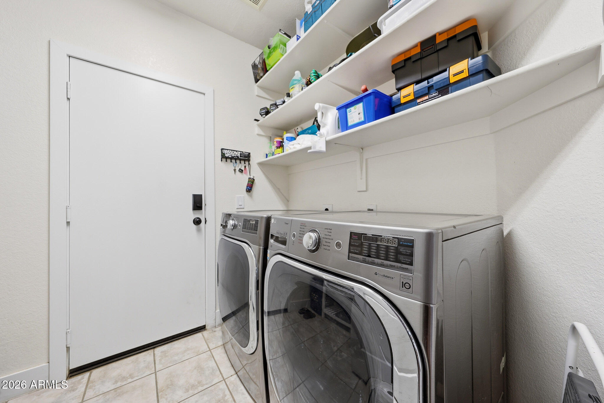 2153 East Kempton Road Chandler, AZ 85225 - Photo 13 of 50 a utility room with dryer and washer