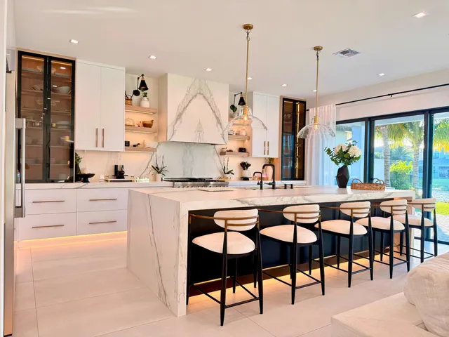 a front view of a house with a yard and a garage