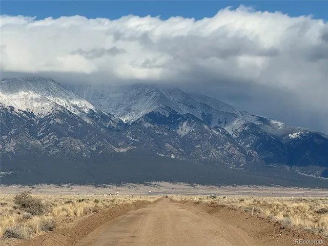 a view of snow on the side of a road