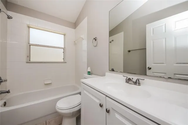 a bathroom with a sink a toilet and a bathtub