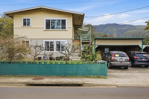 a front view of a house with garden