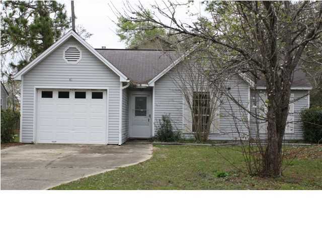 41 3rd Avenue Shalimar, FL 32579 - Photo 1 of 9 a view of a yard in front of a house with large tree