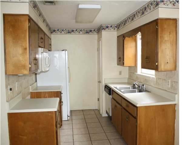 41 3rd Avenue Shalimar, FL 32579 - Photo 2 of 9 a bathroom with a sink a mirror and a shower
