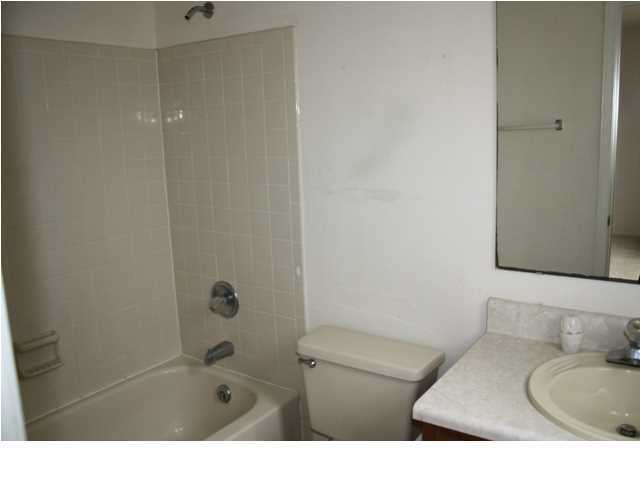 41 3rd Avenue Shalimar, FL 32579 - Photo 9 of 9 a bathroom with a granite countertop sink toilet and shower