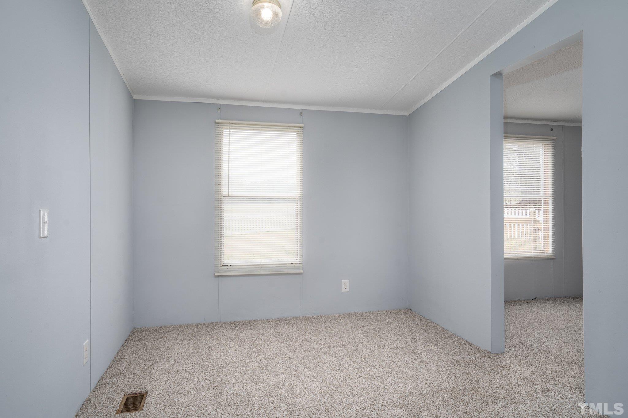 10014 Lake Royale Rd Spring Spring Hope, NC 27882 - Photo 11 of 26 an empty room with a window