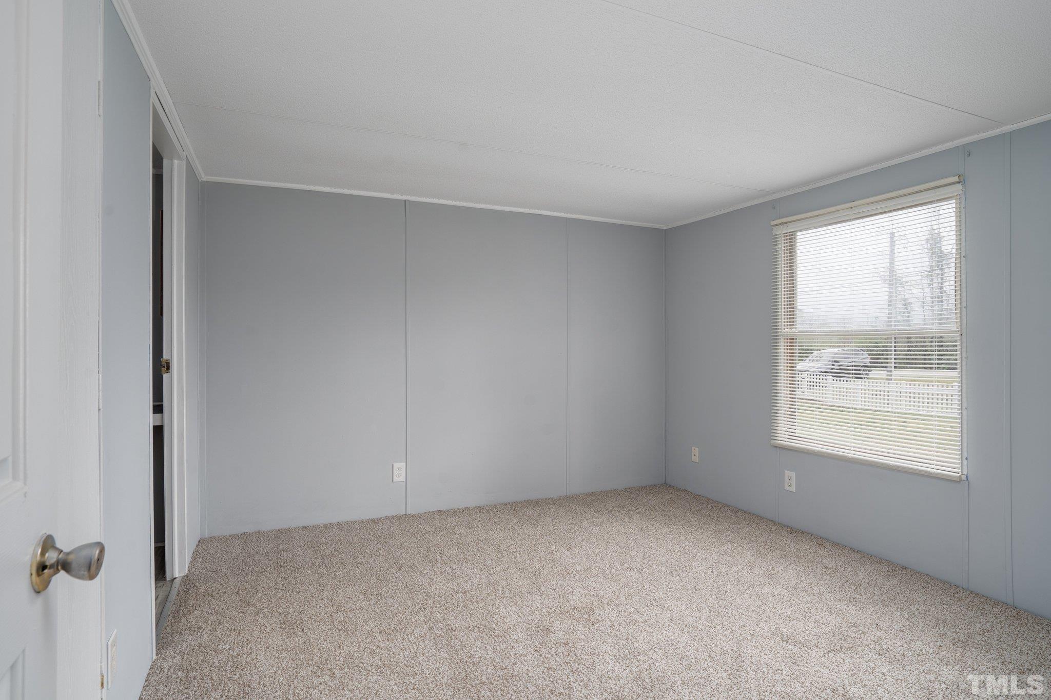 10014 Lake Royale Rd Spring Spring Hope, NC 27882 - Photo 15 of 26 an empty room with windows