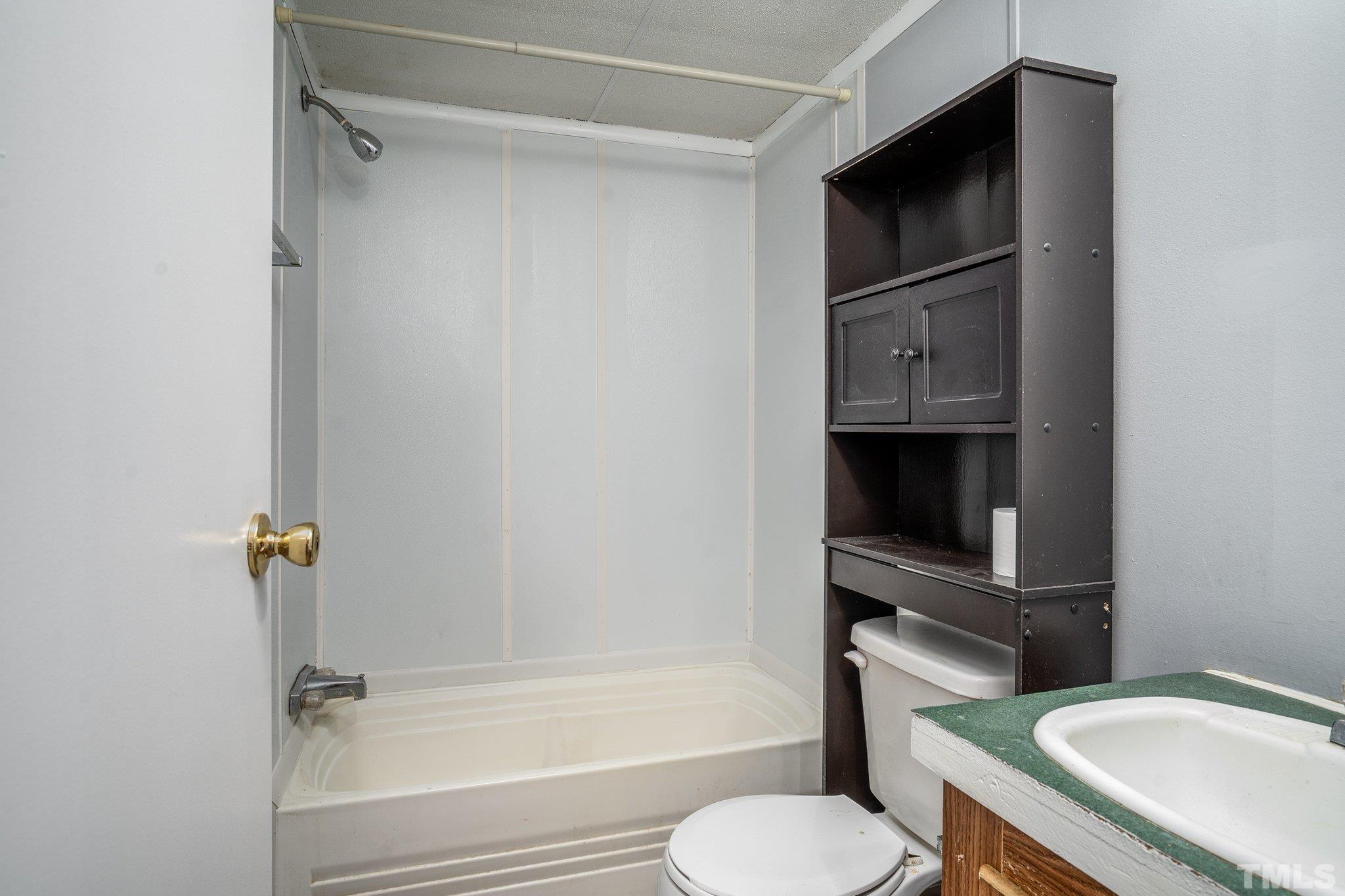 10014 Lake Royale Rd Spring Spring Hope, NC 27882 - Photo 19 of 26 a bathroom with a sink toilet and shower