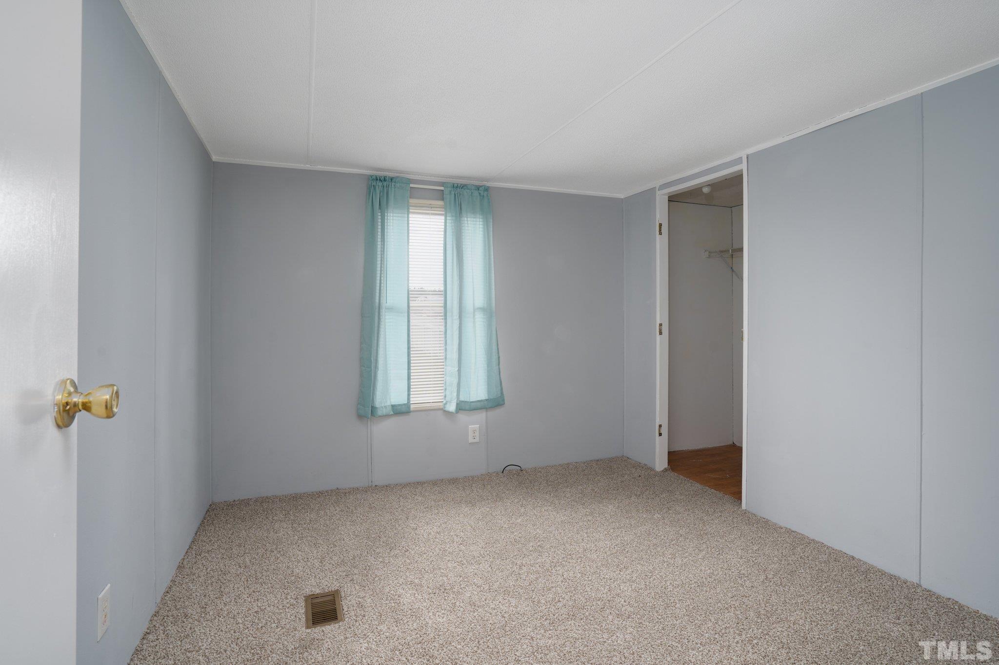10014 Lake Royale Rd Spring Spring Hope, NC 27882 - Photo 21 of 26 an empty room with windows