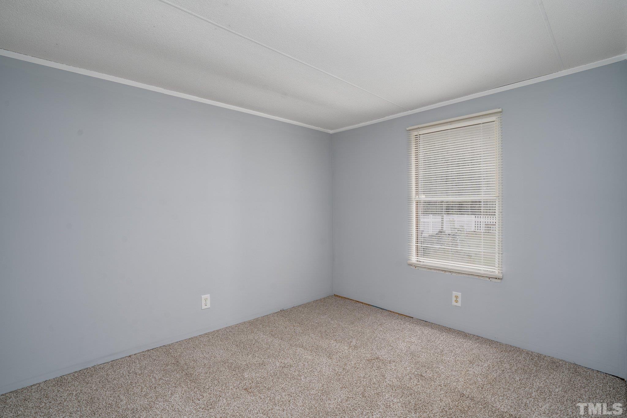 10014 Lake Royale Rd Spring Spring Hope, NC 27882 - Photo 23 of 26 an empty room with a window