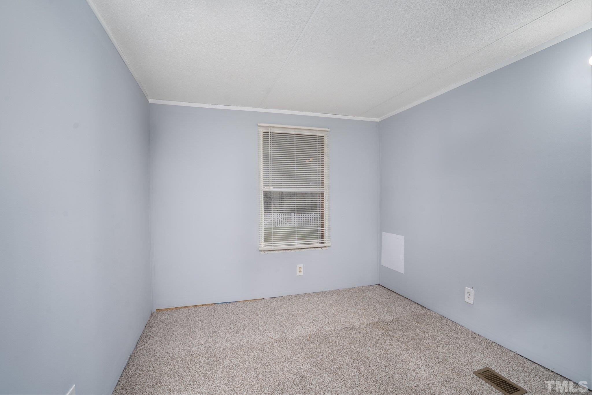 10014 Lake Royale Rd Spring Spring Hope, NC 27882 - Photo 24 of 26 an empty room with a window