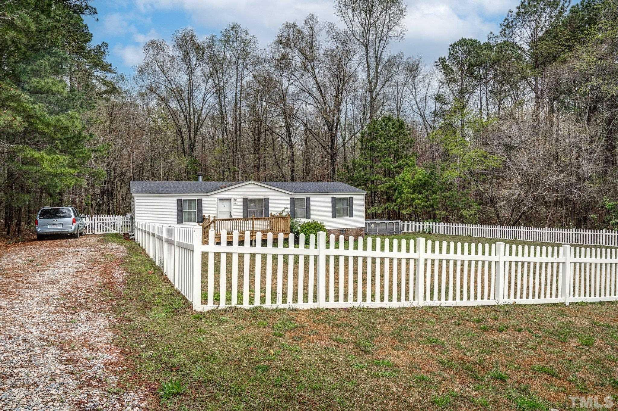 10014 Lake Royale Rd Spring Spring Hope, NC 27882 - Photo 3 of 26 a view of a house with a fence