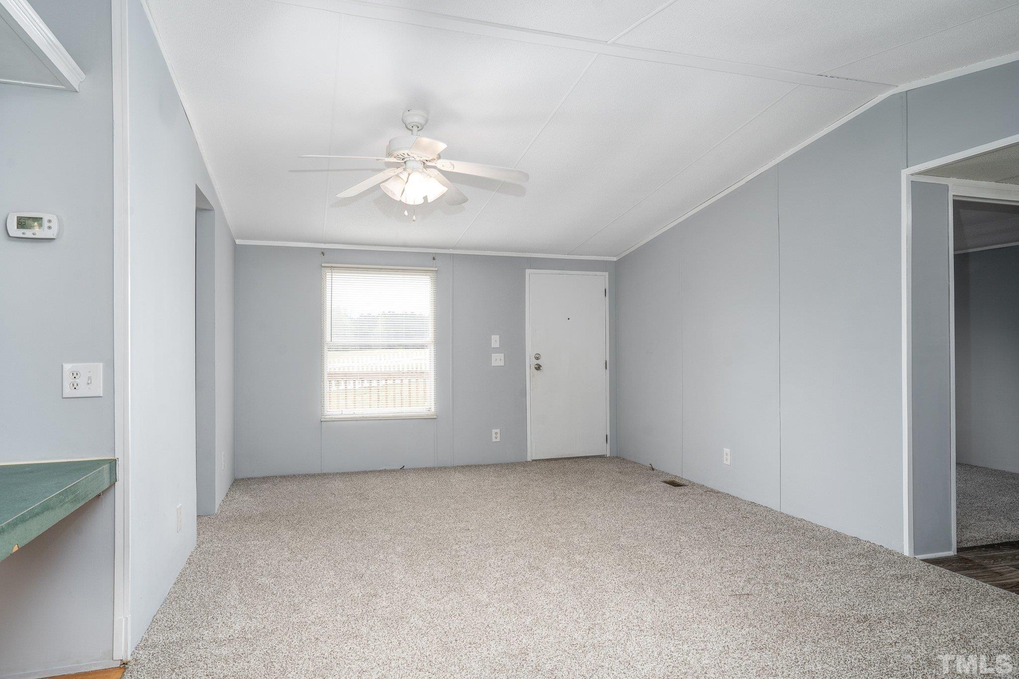 10014 Lake Royale Rd Spring Spring Hope, NC 27882 - Photo 7 of 26 wooden floor in an empty room with a window