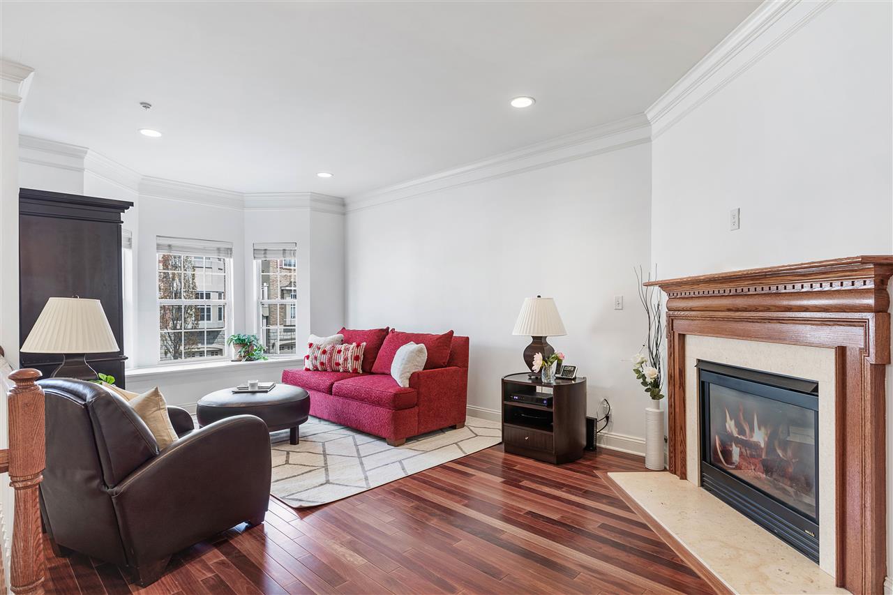 50 Mallard Place Secaucus, NJ 07094 - Photo 1 of 1 a living room with furniture and a fireplace